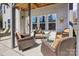 Inviting covered patio with comfortable seating, perfect for enjoying the lake view at 21610 Rio Oro Dr, Cornelius, NC 28031