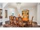 Elegant dining room featuring a wood table, chandelier, and decorative rug, perfect for gatherings at 21610 Rio Oro Dr, Cornelius, NC 28031