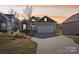 Charming home with a well-maintained lawn, front door and attached two car garage at 21610 Rio Oro Dr, Cornelius, NC 28031