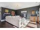 Stylish living room with dark walls, plush rug, elegant furniture, and hardwood flooring at 21610 Rio Oro Dr, Cornelius, NC 28031