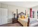 Comfortable bedroom with a four-poster bed, stylish lamps, and neutral decor for relaxation at 21610 Rio Oro Dr, Cornelius, NC 28031