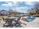 Stunning pool with waterfront views, perfect for relaxing and entertaining with an outdoor dining set at 21610 Rio Oro Dr, Cornelius, NC 28031