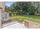 Spacious wood deck overlooking a vast green lawn, perfect for relaxation and entertaining in a serene setting at 2632 Montford Nw Ave, Concord, NC 28027