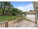 This wooden deck offers an amazing view of the yard, trees, and sky making it perfect for entertaining at 2632 Montford Nw Ave, Concord, NC 28027