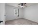 Bedroom featuring hardwood-style floors, white walls, ceiling fan, and a bright window at 2632 Montford Nw Ave, Concord, NC 28027