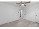 Bright bedroom featuring hardwood-style floors, white walls, and a view to the bathroom at 2632 Montford Nw Ave, Concord, NC 28027
