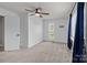 Bright bedroom with a large window, plush carpeting, and neutral walls with blue curtains at 2632 Montford Nw Ave, Concord, NC 28027