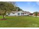 Charming single-story home with a well-manicured lawn, blue shutters, and inviting curb appeal at 2632 Montford Nw Ave, Concord, NC 28027
