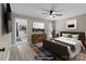 Staged bedroom with a large bed, wood furniture, and a neutral color scheme at 2632 Montford Nw Ave, Concord, NC 28027