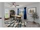 Home office with a large desk, blue curtains, a decorative rug, and ample natural light at 2632 Montford Nw Ave, Concord, NC 28027