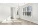 Inviting dining area with wood floors, large windows, and bright lighting, perfect for Gathering meals at 279 Miramar Dr, York, SC 29745