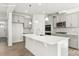 Modern kitchen with gray cabinets, stainless steel appliances, and a large white center island at 279 Miramar Dr, York, SC 29745