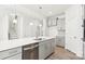 Kitchen featuring stainless steel appliances, gray cabinets, a large island, and stairs to second floor at 279 Miramar Dr, York, SC 29745