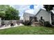 Backyard featuring a fire pit, string lights, and a wooden deck, perfect for outdoor entertaining at 303 N Main N St, Granite Quarry, NC 28146