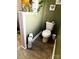 Cozy bathroom with toilet, decorative storage for toilet paper, and olive green walls at 303 N Main N St, Granite Quarry, NC 28146