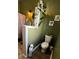 This eclectic bathroom features unique plants and olive green paint at 303 N Main N St, Granite Quarry, NC 28146