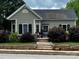 Charming home with new roof, stone accents, updated landscaping, and a cozy front porch at 303 N Main N St, Granite Quarry, NC 28146
