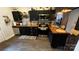 Modern kitchen with stainless steel appliances, stylish backsplash, and rustic butcher block countertops at 303 N Main N St, Granite Quarry, NC 28146