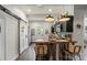 Stylish kitchen featuring dark cabinetry, stainless appliances, butcher block countertops and island seating at 303 N Main N St, Granite Quarry, NC 28146