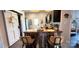 Modern eat in kitchen with black cabinets, butcher block countertop with chairs, barn door, and stainless appliances at 303 N Main N St, Granite Quarry, NC 28146