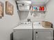 Laundry room with side-by-side washer and dryer and shelving unit at 303 N Main N St, Granite Quarry, NC 28146