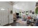 Cozy living room featuring hardwood floors, neutral paint, and a comfortable gray sectional sofa at 303 N Main N St, Granite Quarry, NC 28146