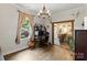 Living room with view into eat-in kitchen with island and bar stool seating at 303 N Main N St, Granite Quarry, NC 28146