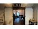 Open doorway with rustic barn doors leading to a stylishly decorated living space at 303 N Main N St, Granite Quarry, NC 28146