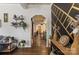 Bright entryway featuring dark wood floors and archway leading to eat-in kitchen at 303 N Main N St, Granite Quarry, NC 28146