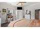 Cozy main bedroom featuring corner window, neutral tones, and access to the ensuite bathroom at 303 N Main N St, Granite Quarry, NC 28146