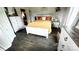 Serene bedroom with a wooden bed frame, decorative pillows, and matching nightstands at 303 N Main N St, Granite Quarry, NC 28146