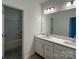Well-lit bathroom featuring a double vanity, large mirror, and a shower/tub combo at 3117 Beacon Heights Rd, Indian Land, SC 29707