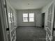 Bright bedroom with ample natural light, neutral carpet, and closet space at 3117 Beacon Heights Rd, Indian Land, SC 29707