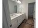Bathroom with double sink vanity, a large mirror, and modern fixtures at 3121 Beacon Heights Rd, Indian Land, SC 29707