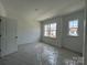 Cozy bedroom with a bright window, perfect for relaxation and personalization at 3121 Beacon Heights Rd, Indian Land, SC 29707