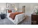 Cozy bedroom with neutral color scheme, decorative pillows, and ensuite bathroom access at 3121 Beacon Heights Rd, Indian Land, SC 29707