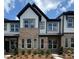 Charming townhome featuring a brick and siding exterior with black trim accents at 3121 Beacon Heights Rd, Indian Land, SC 29707