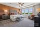 Spacious main bedroom with tray ceiling, ceiling fan, large windows, and nature views at 3121 Beacon Heights Rd, Indian Land, SC 29707