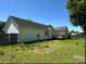 A well-sized backyard with a wooden fence and deck, ready for enjoying outdoor living at 3240 St Vincent Dr, Claremont, NC 28610