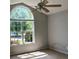 Sunlit bedroom with large window and vaulted ceiling at 3240 St Vincent Dr, Claremont, NC 28610