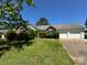 Well-maintained single story home with brick and siding, a green lawn, and an attached two car garage at 3240 St Vincent Dr, Claremont, NC 28610