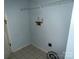 Functional laundry area with shelving, hookups, and tiled flooring ready for your appliances at 3240 St Vincent Dr, Claremont, NC 28610