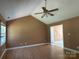 Spacious living room with vaulted ceiling, ceiling fan, neutral walls, and wood-look flooring at 3240 St Vincent Dr, Claremont, NC 28610