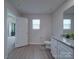 Bright bathroom featuring a granite vanity top, sleek fixtures, and a window for natural light at 3322 Brighton Dr, Gastonia, NC 28052