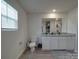 Bright bathroom with granite countertops, modern fixtures, and a window for natural light at 3322 Brighton Dr, Gastonia, NC 28052