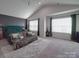 Large bedroom with an accent wall, vaulted ceilings, and plush throw on the bed at 3322 Brighton Dr, Gastonia, NC 28052