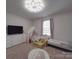 Bright bedroom featuring a whimsical tent, comfortable bed, and creative light fixture at 3322 Brighton Dr, Gastonia, NC 28052