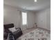 Bright bedroom featuring neutral walls and carpet, a rocking chair, a large window, and a closet at 3322 Brighton Dr, Gastonia, NC 28052