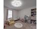 Charming bedroom with heart decals, a playful bed, and a well-organized toy storage area at 3322 Brighton Dr, Gastonia, NC 28052