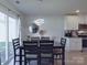 A well lit dining area with stylish light fixture and seating for six at 3322 Brighton Dr, Gastonia, NC 28052